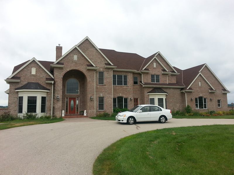 Large brick home with new gutters