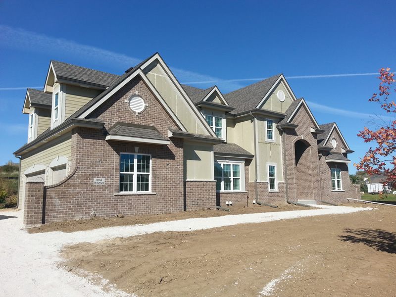 New construction home with gutters installed