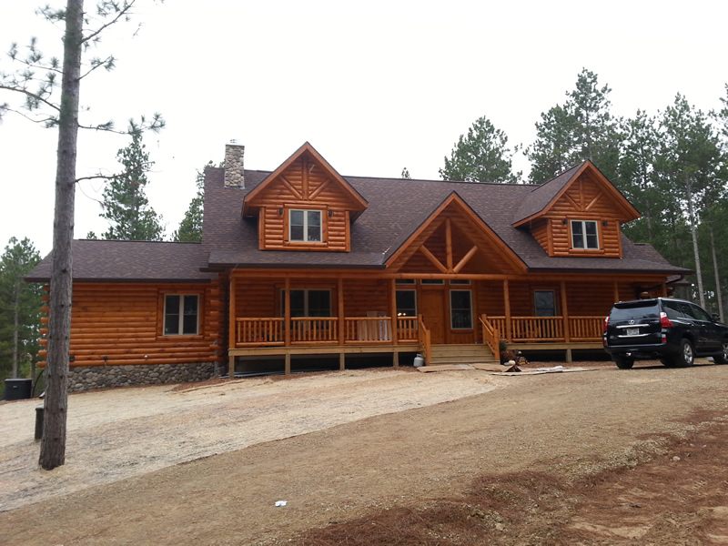 Log home with new gutters