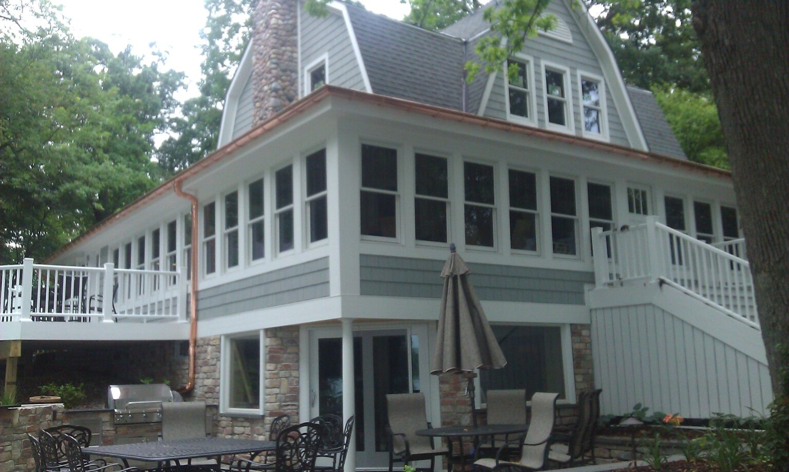 Lake house with copper gutters and downspouts